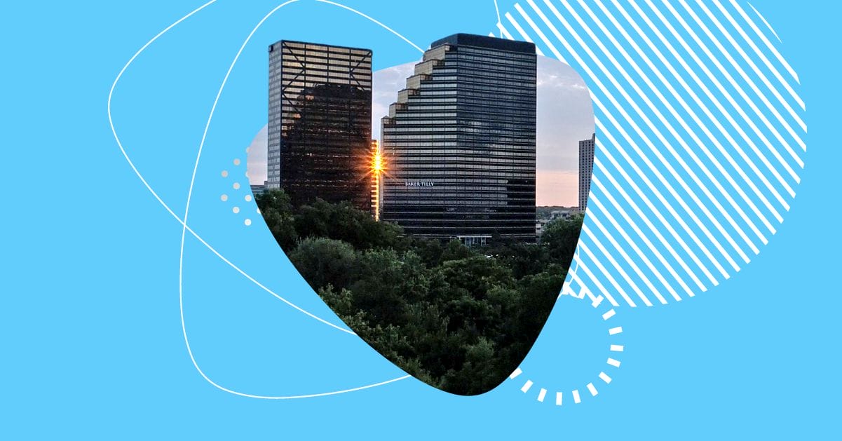 Sun setting behind two office towers in Southfield, Michigan, with trees in the foreground and the Apex Digital brand style framing the image.