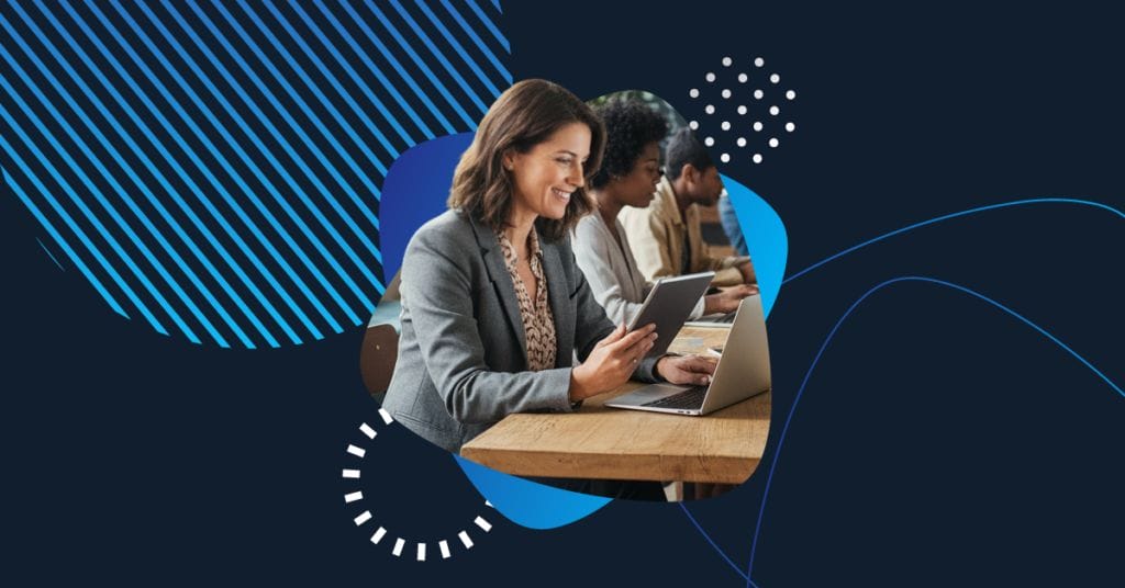 Business professionals representing nonprofit organizations collaborate using laptops and tablets, symbolizing digital transformation and technology adoption in the nonprofit sector.